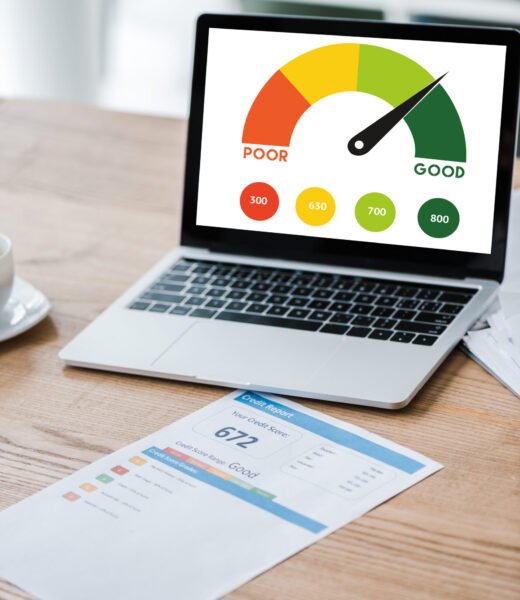 laptop with speed meter on screen near paper with credit report on desk